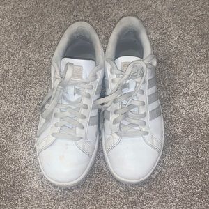 Gray and White Adidas sneakers.
